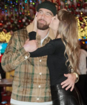 Taylor Swift congratulates beau Travis Kelce with a kiss after win